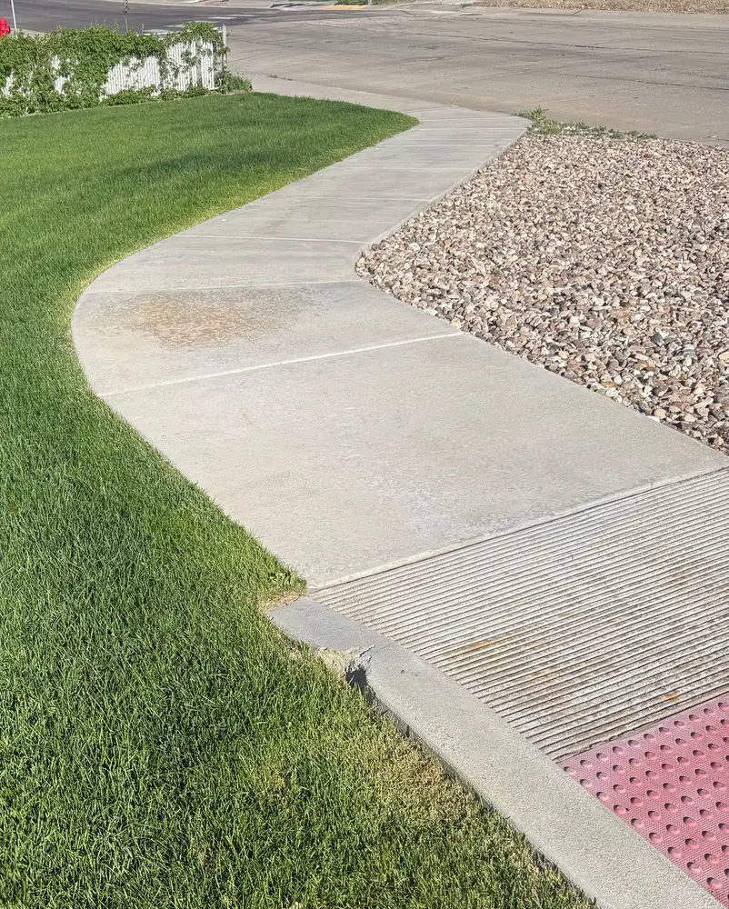 Fresh, straight edge cut along a sidewalk with the edger